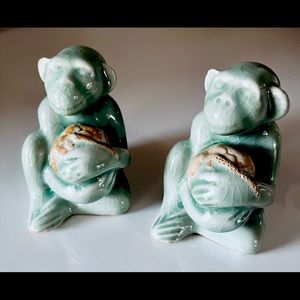 Vintage pair handmade ceramic monkey with coconut Thailand made One signed. 3.5”